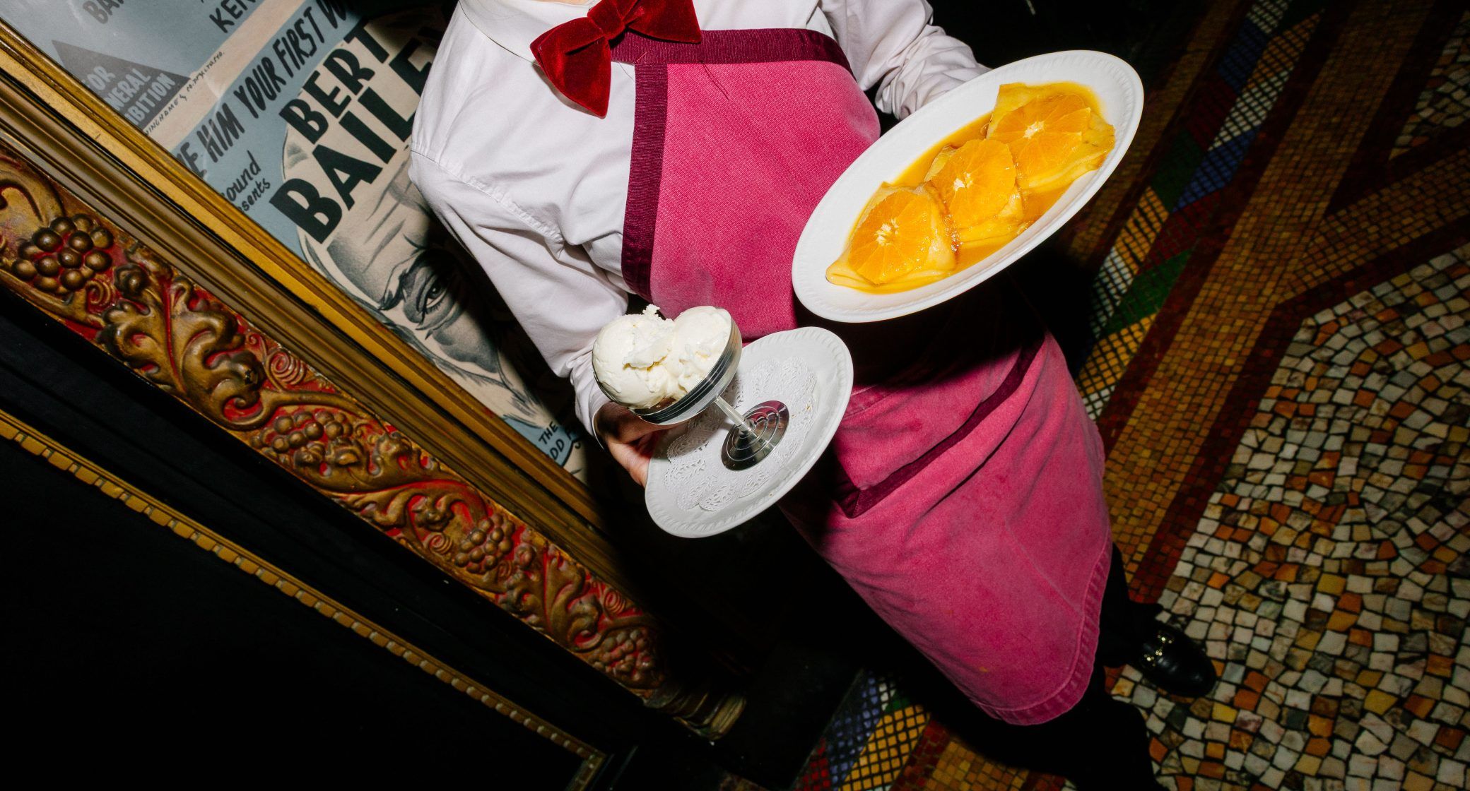 Parlour service detail with desserts and Art Deco surroundings